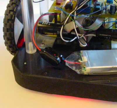 Floor and encoder sensor red light under baffle.