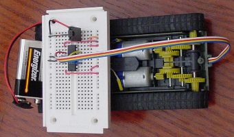 Tank with solderless breadboard for prototyping. Notice the gear box