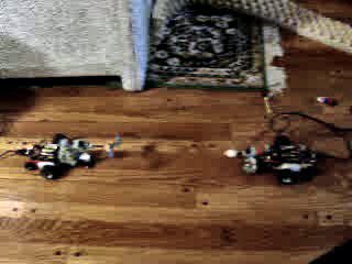 Click to see a movie of two Atari-joystick remote-controlled robots crashing into each other.