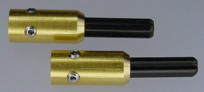 A pair of finished brass couplers ready to install on a robot motor.