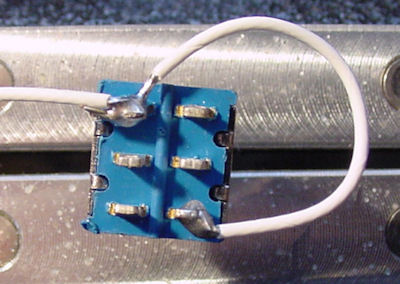 Solder the white (power positive) wires to the DPDT switch.
