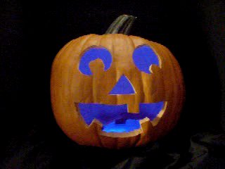Click to see a movie of a pumpkin with a blue pulsing LED.