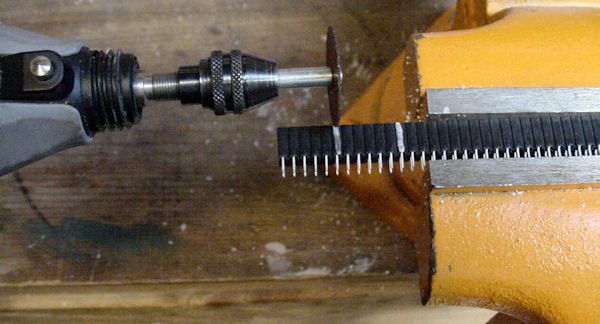 Dividing sockets in a vise with Dremel cut off disc.