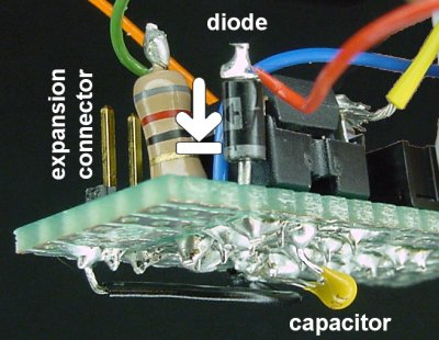 A diode, capacitor, and expansion connector are added.
