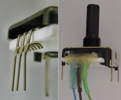 Non-conductive epoxy secures the delicate pins in place on an older-model rotary encoder.