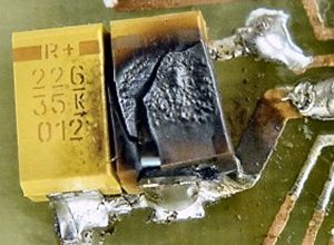 A critical failure of a surface-mount tantalum capacitor. There was a short circuit, followed by a small fire, and some stinky smoke.