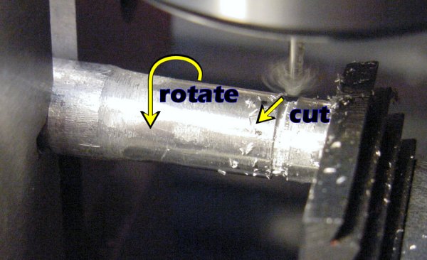 Milling an inner groove on an aluminum rod.