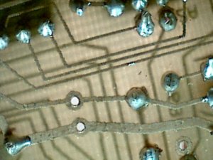PCB at 10x magnification, lit from below (plus room lighting from above)