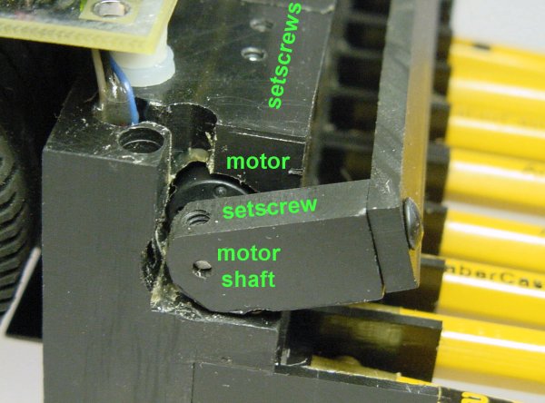 A miniature Maxon DC motor held in place by setscrews operates the drop-down bar on the robot.