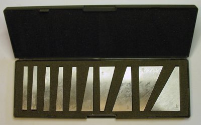 A set of fixed metal angle blocks or angle parallels.